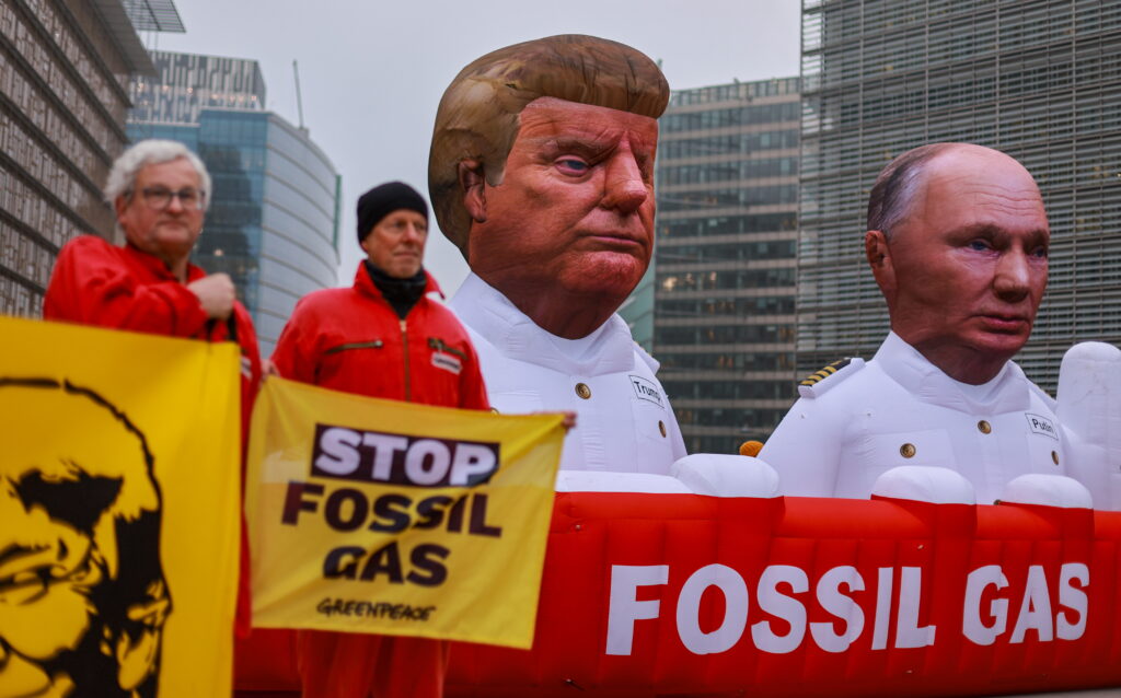epa12682026 Activists of the environmental organization Greenpeace hold inflatables depicting President Donald Trump and Russian President Vladimir Putin as they protest against Europe